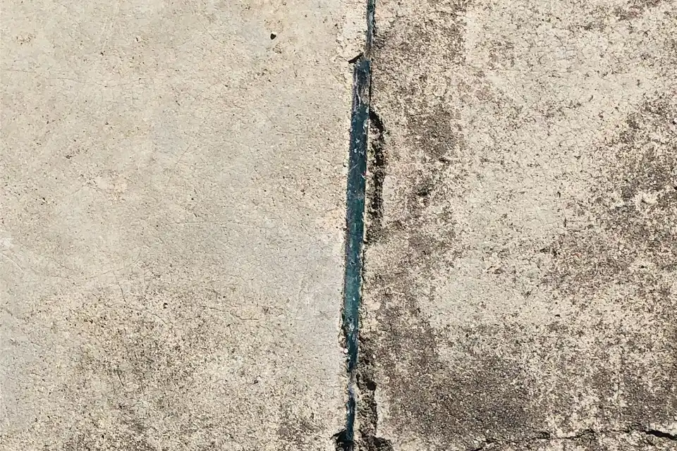 Cracked, settled concrete slabs